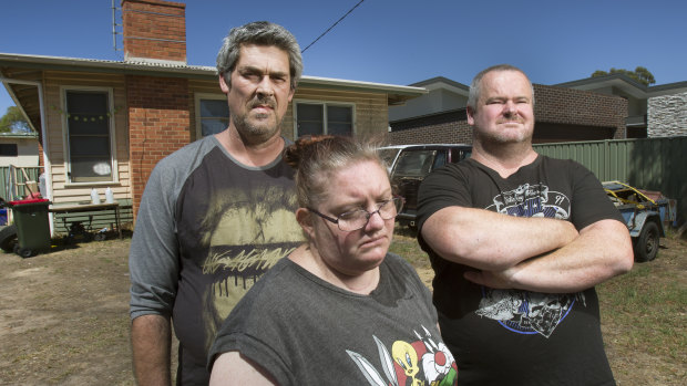 From left: Ronald Lyons, Christine Lyons and Peter Arthur outside their Kangaroo Flat home in the days after Samantha Kelly went missing.