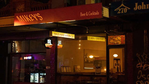 Mikey’s is a new bar in Abbottsford featuring a martini stained-glass window (right).