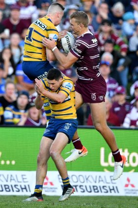 Tom Trbojevic flies high to snatch the ball from Clint Gutherson for a brilliant Manly try.