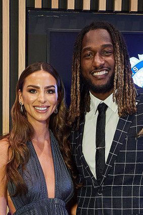 Nic Naitanui and partner Brittany Brown pose for a photo during the 2020 Brownlow Medal Count at Optus Stadium.