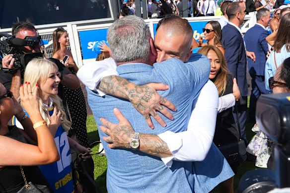 Former Richmond champion Dustin Martin embraces trainer Clinton McDonald after the Blue Diamond Stakes.
