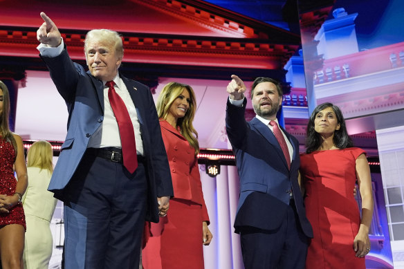 Trump stands on stage with wife Melania, and Republican vice presidential candidate J.D. Vance and his wife, Usha Chilukuri Vance.