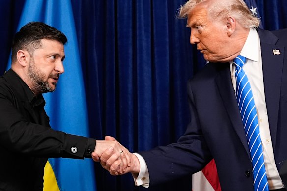 Ukrainian President Volodymyr Zelensky and US President Donald Trump shake hands at the start of a joint news conference following the meeting at Trump’s Mar-a-Lago club.