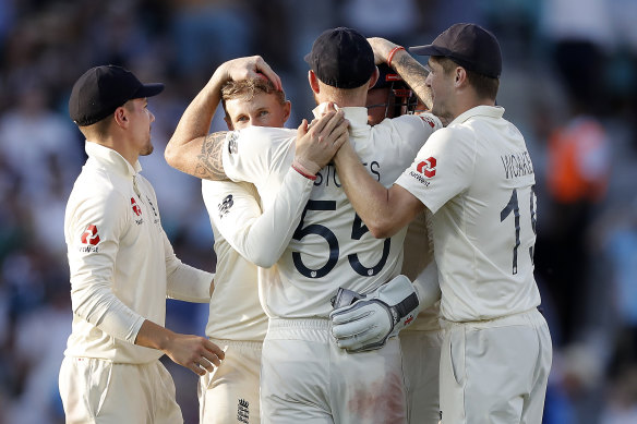 England celebrate the wicket of Matthew Wade.