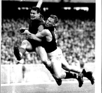 1957 was a great year for...Barassi. Here is the demon kicking a great goal for Melbourne as Essendon back pocket player Bob Suter tries to smother him. June 21, 1982.