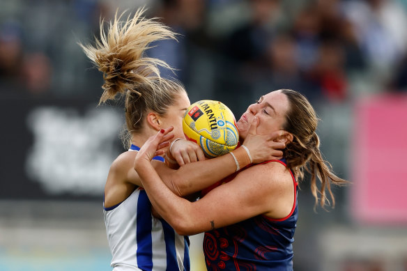 The Kangaroos’ Alice O’Loughlin and Melbourne’s Maeve Chaplin battle for the ball.