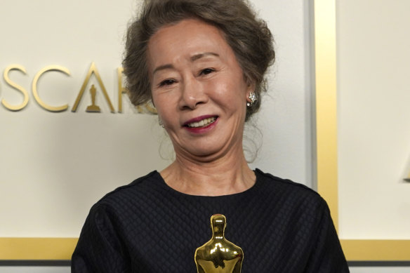 Yuh-Jung Youn with the Oscar for best actress in a supporting role for <i>Minari</i>.