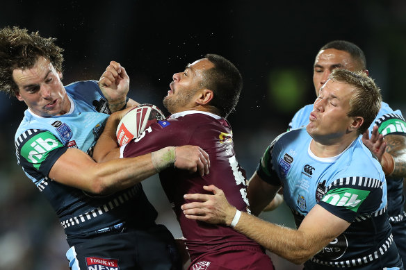 Phillip Sami is tackled in Adelaide.