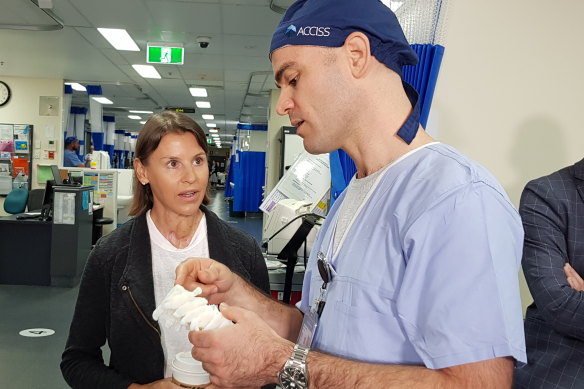 Adam Frankel shows Keri Frecklington the 3D model of her spine produced for the surgeon’s reference prior to her operation.