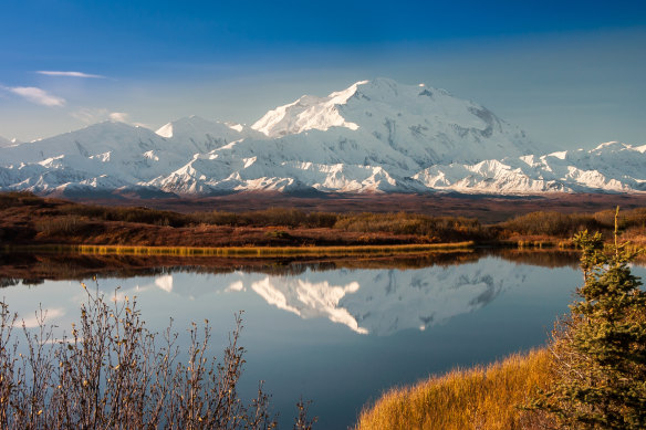 Denali reflected on Wonder Lake in Denali National Park in Alaska.