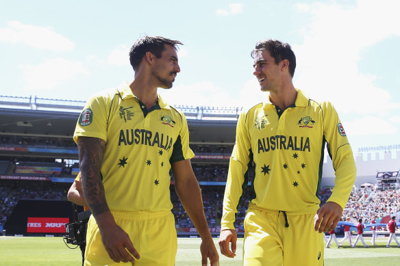 Former teammates Mitchell Johnson and Pat Cummins.