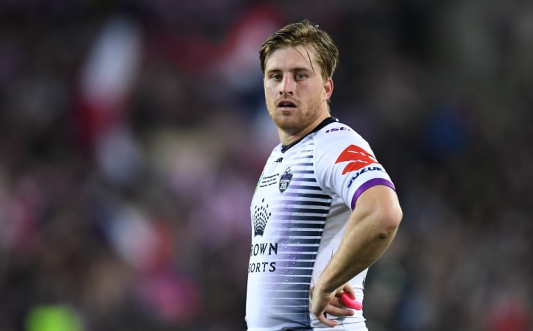 Taking time out: Storm and Kangaroos five-eighth Cameron Munster.