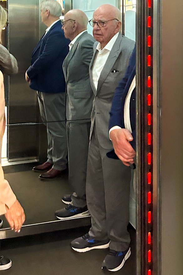 Rupert Murdoch is seen leaving the Herald Sun building in Melbourne with columnist Andrew Bolt.