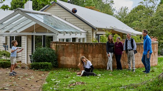 Happy home: children Manning and Audrey with mother Zoe Flanagan-Field, Zoe’s parents, Robin and Warwick Mosman, and father Craig Field, outside the home they share in the Blue Mountains.