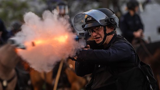 Los Angeles Police Department officers shoot rubber bullets at protesters in front of the City Hall on the weekend.