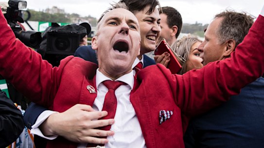 Punters celebrate Redzel winning the TAB Everest horse race at Royal Randwick last October.
