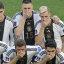 German players cover their mouths to protest against being gagged by FIFA.