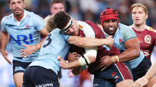 SYDNEY, AUSTRALIA - MAY 31:  Josh Nasser of the Reds is tackled during the round 15 Super Rugby Pacific match between NSW Waratahs and Queensland Reds at Allianz Stadium, on May 31, 2024, in Sydney, Australia. (Photo by Matt King/Getty Images)