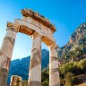 A greek temple at the base of a mountain range sundec8greece Greece ancient Olympia Peloponnese region Olympics ; text by Steve McKenna ; iStock *** REUSE PERMITTED ***Â 