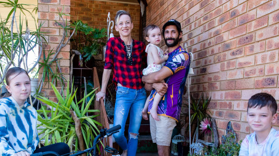 Mother Courtney, father Stephen Lardner, son Jason, daughter Imogen and youngest daughter Cassidy from Ruse Imogen is going into year 6 this year, and Jason into year 5Back to school story focused on inequality and digital divide. This family is part of the Smith Family learning for life program; case study for the struggles and inequalities exposed by COVID last year. 22nd Jan 2021. Photo: Edwina Pickles / SMH