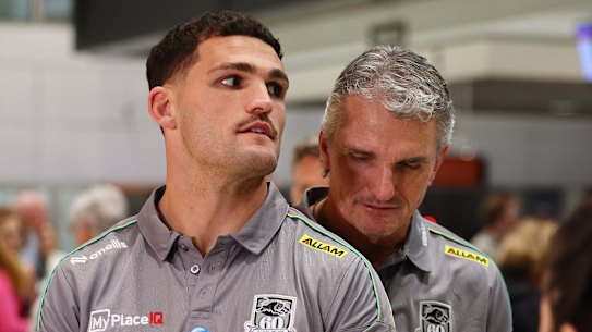 Nathan Cleary (left) and his father Ivan Cleary at Brisbane airport on Saturday night. 