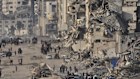 Displaced Palestinians walk past the ruins of destroyed buildings along the Gaza City shoreline on Monday, June 9, 2025. (AP Photo/Jehad Alshrafi)