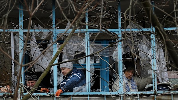Residents clean up the damage from a missile attack at 2.40 am on Monday 14th of March.