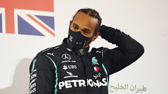 Lewis Hamilton of Great Britain celebrates on the podium during the F1 Grand Prix of Bahrain on Sunday, November 29.