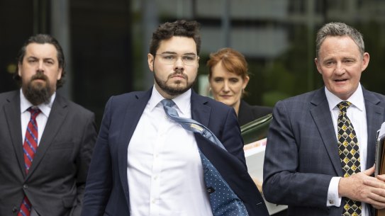 Bruce Lehrmann (centre) leaving court in Canberra on Tuesday.