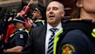 Tony Mokbel walks free from court on Friday after almost 18 years behind bars.