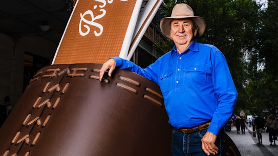 Terry Goodear is in charge of heritage and heartland marketing at RM Williams. Here he poses with pop-up boot in Piitt St mall.