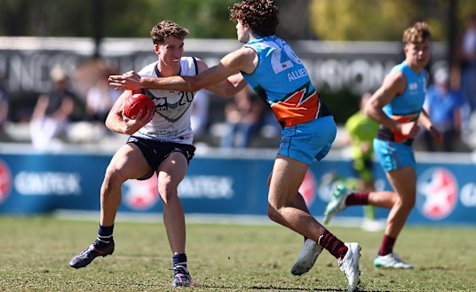 Jack Whitlock fends off a rival during this year’s AFL under-18 championships.
