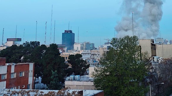 Smoke billows from a strike near the former US embassy in Tehran.
