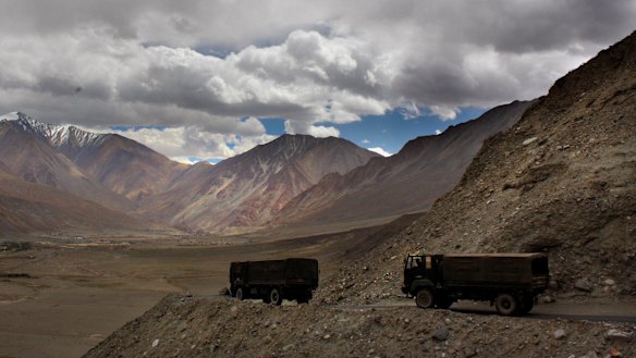 Indian army trucks drive near Pangong Tso lake near the India-China border in India's Ladakh area in 2017. 