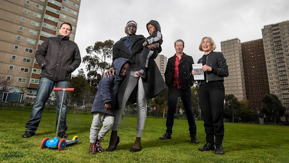 (From left) Atherton Gardens residents Ranko Cosic and Jenny Nyibol and her children, with City of Yarra councillor Stephen Jolly and residents association member Margaret O'Brien.