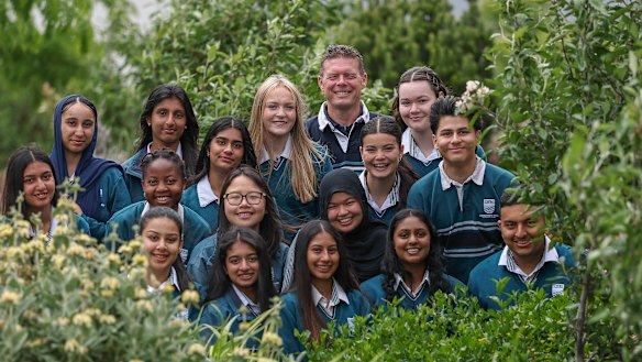 Cranbourne West Secondary College principal Rob Duncan with VCE high achievers.