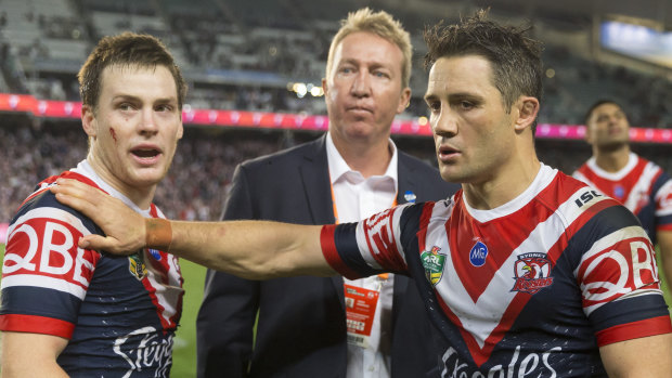 Aftermath: Luke Keary, Trent Robinson and Cooper Cronk count the costs of victory.