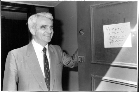 Headmaster Reg St Leon welcomes the pupils back to school after days of not knowing if they had a school or not,
September 10, 1986. 