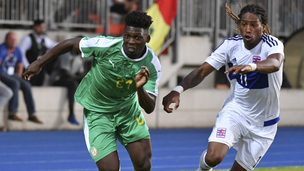 Bore draw: Senegal'sLamine Gassama is chased by Luxembourg's Gerson Rodrigues.