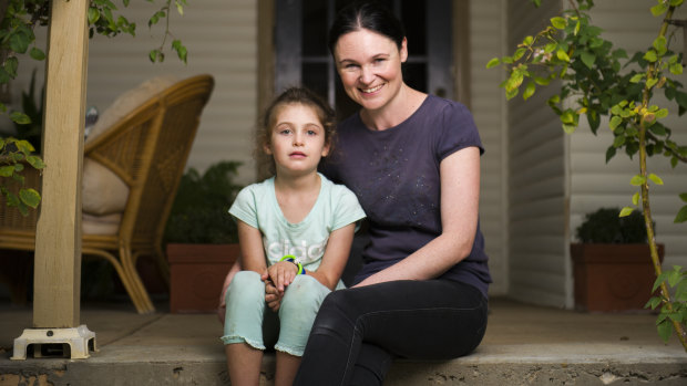 Evie Clark and her mother Samara Zeitsch at their home a week after Evie was stung up to 300 times when she fell into a wasp nest. 