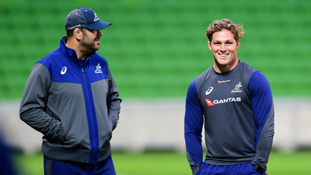 Upbeat: Wallabies coach Michael Cheika chats with Australian captain Michael Hooper at AAMI Park ahead of Saturday's Test against Ireland. 