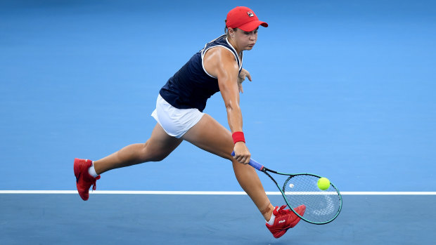 Ash Barty reaches for a backhand during the doubles final of the Brisbane International. 