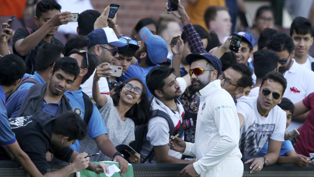 Star power: Rohit Sharma meets fans during a break in India's tour match in Sydney.