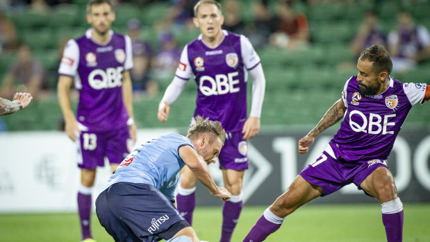 Down, not out: Sydney FC's Siem De Jong challenged by Glory players in Perth.
