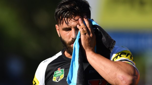 Lucky: Josh Mansour leaves the field after sustaining the injury against Gold Coast Titans