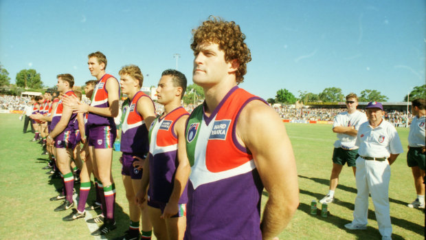 The Dockers line up for the first match against an AFL team, a practice match against Essendon.