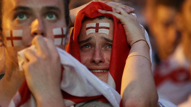 Devastated England fans after Croatia scored the winning goal. 