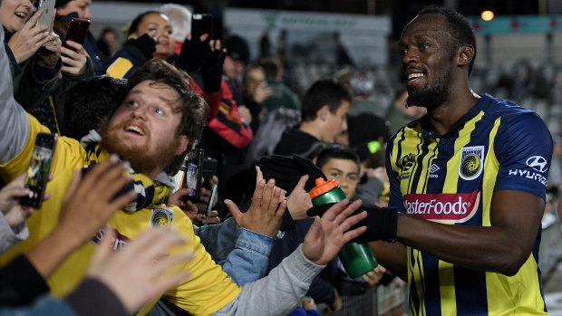 Star power: Reactions have ranged from harsh to kind after Usain Bolt's debut, but Mariners fans enjoyed the spectacle.