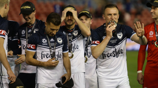 Berisha (right) wins the 2018 A-League grand final with Victory.