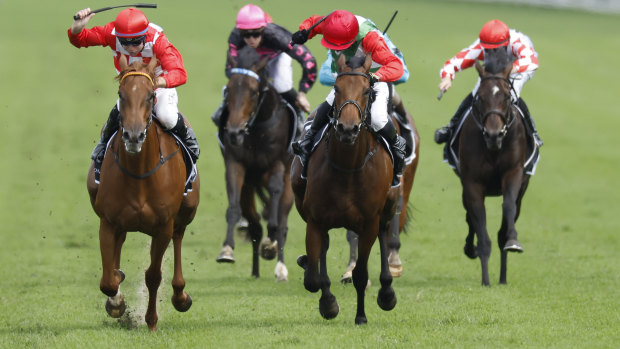 Tommy Berry on She’s Extreme (left) beats Brenton Avdulla on Fireburn in the Champagne Stakes.